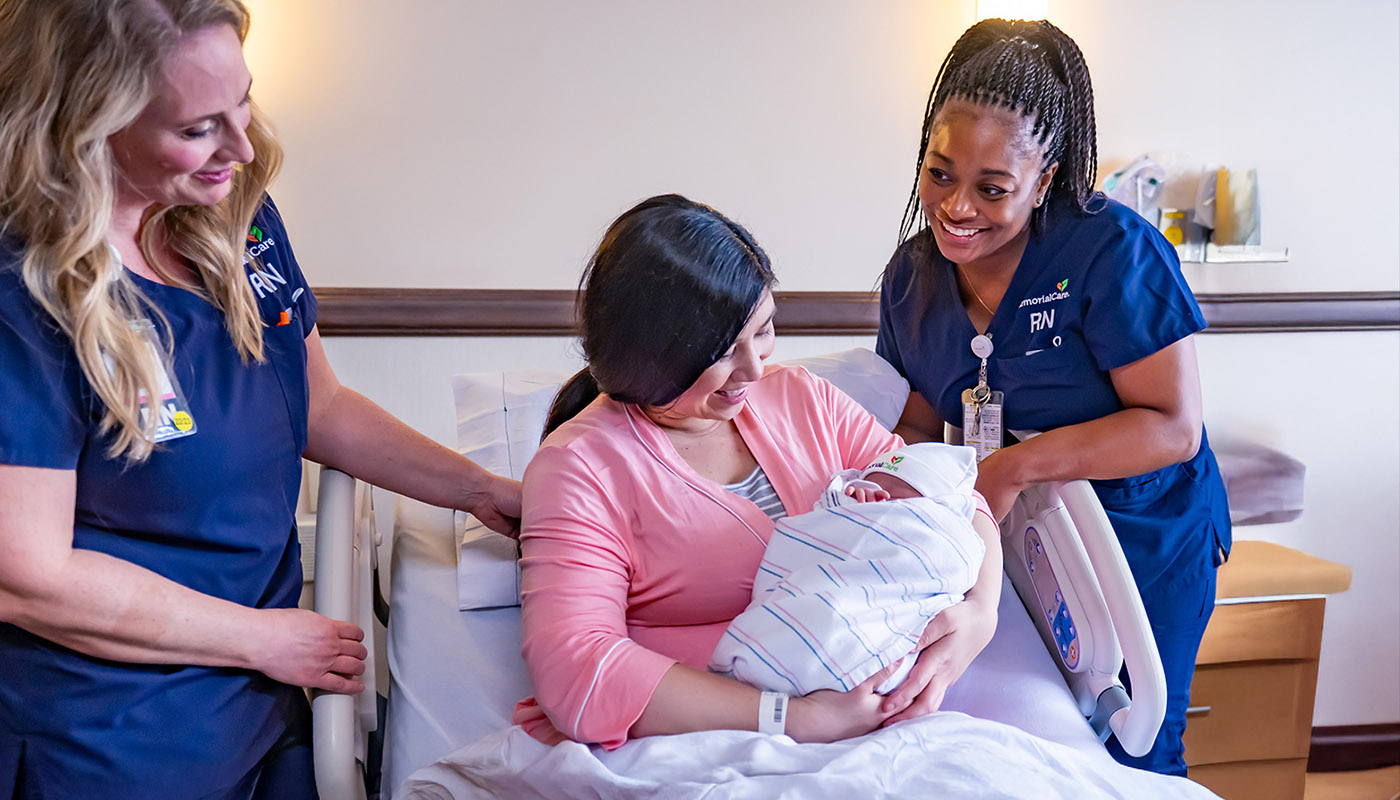 Mom with Nurses and Baby