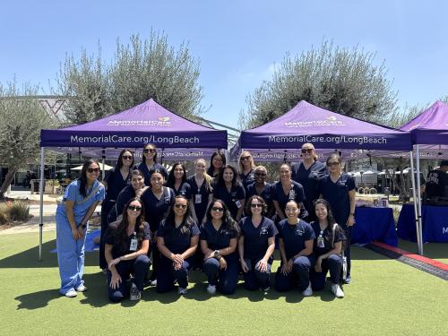MemorialCare Long Beach Medical Center nurses gather after leading hands-only CPR training at a “Sidewalk CPR” event, supporting efforts to improve bystander CPR rates across the Long Beach community.
