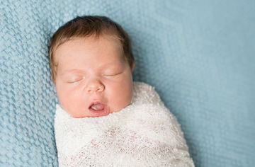 Image of baby sleeping on blanket